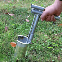 Hand held seedling transplanter